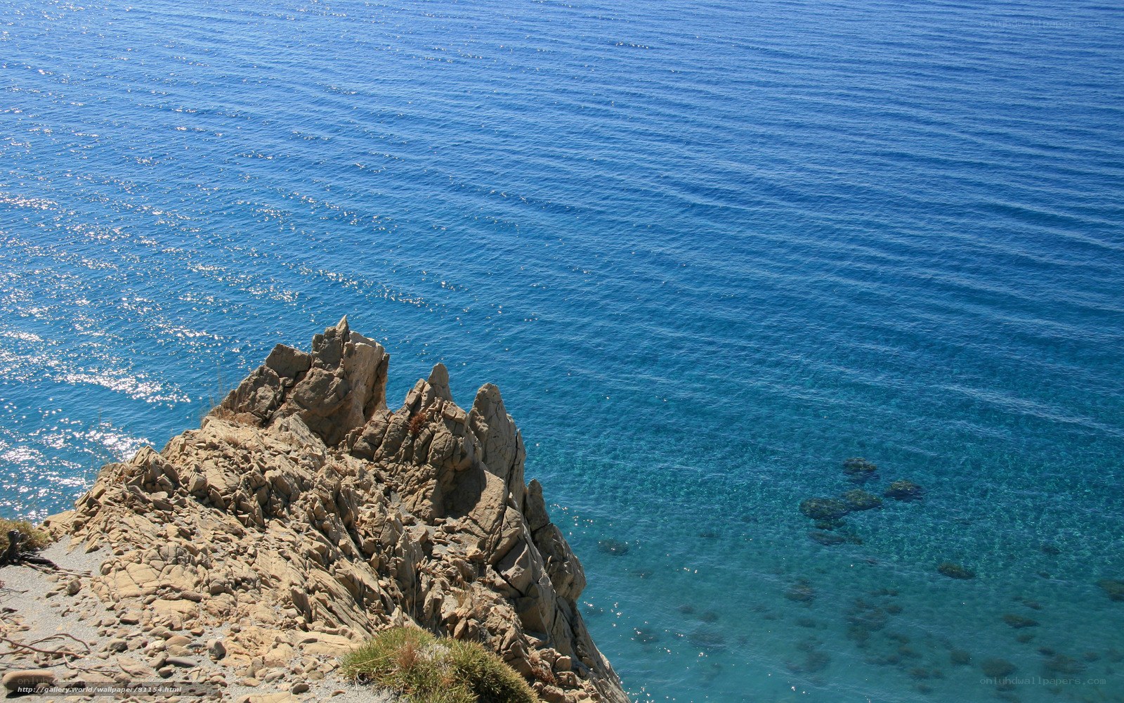 Rugged cliff overlooking blue sea