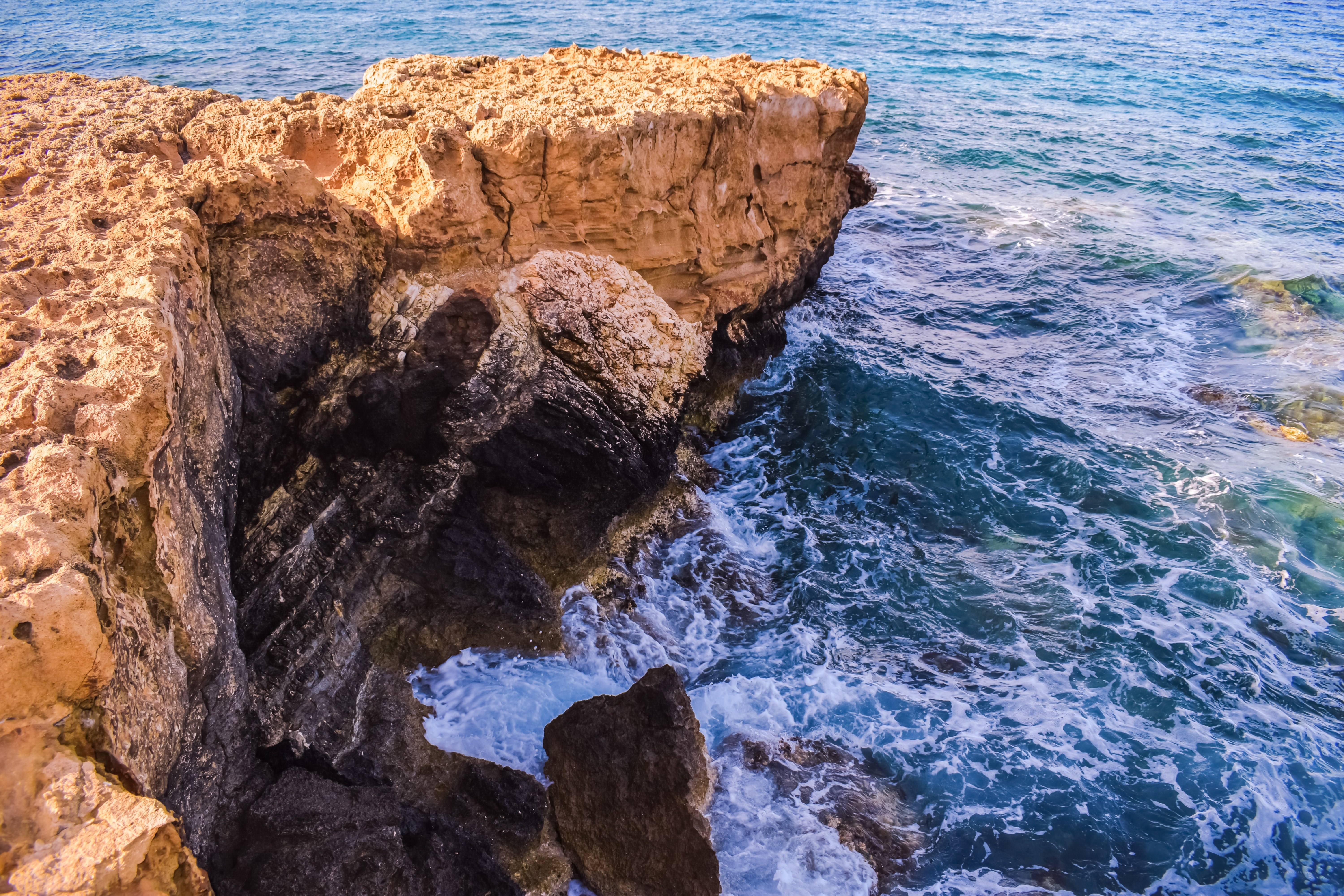Rugged cliffs meet the sea