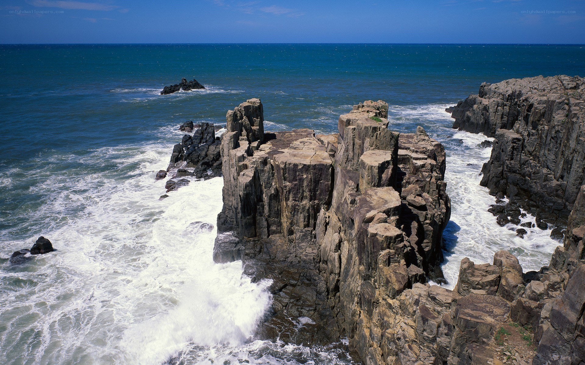 Rugged coastal cliffs and crashing waves