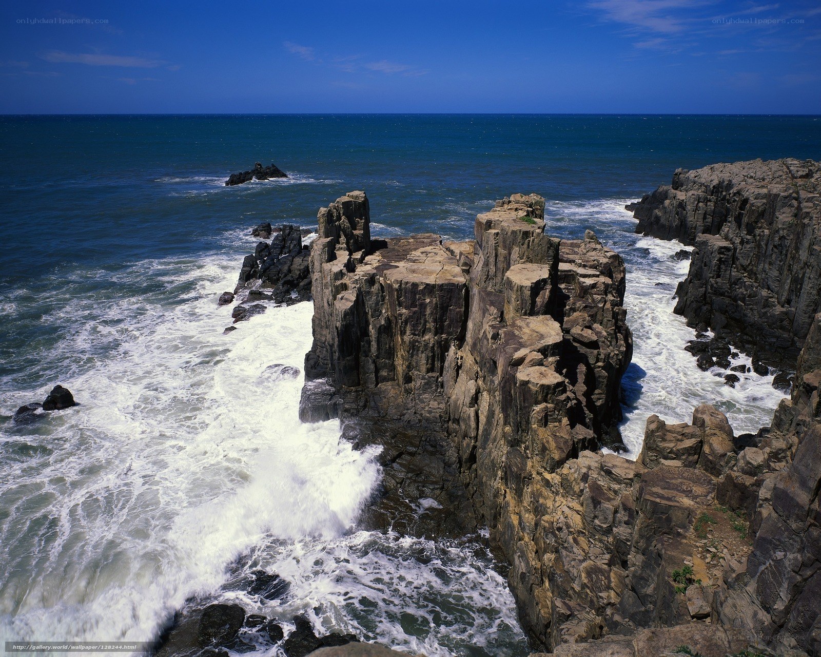 Rugged coastal cliffs and crashing waves