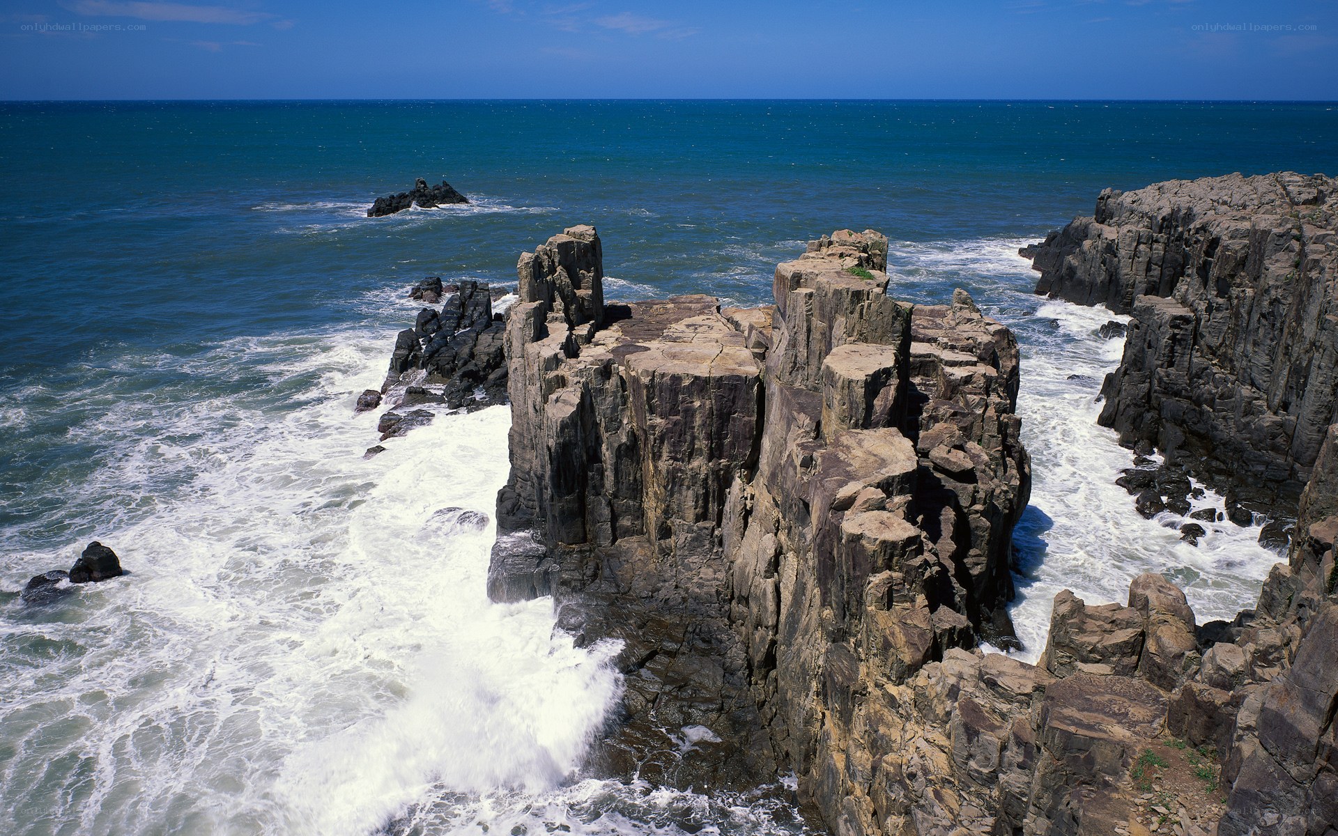 Rugged coastal cliffs and ocean waves