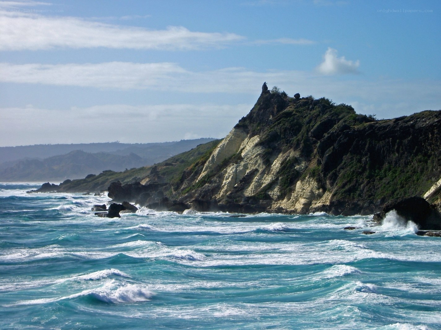 Rugged coastal cliffs and turquoise waves