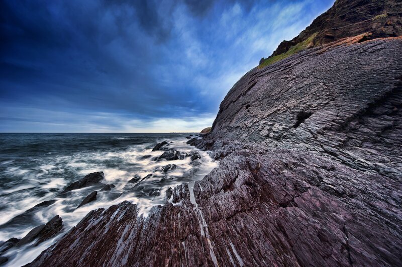 Rugged coastal cliffs at dusk