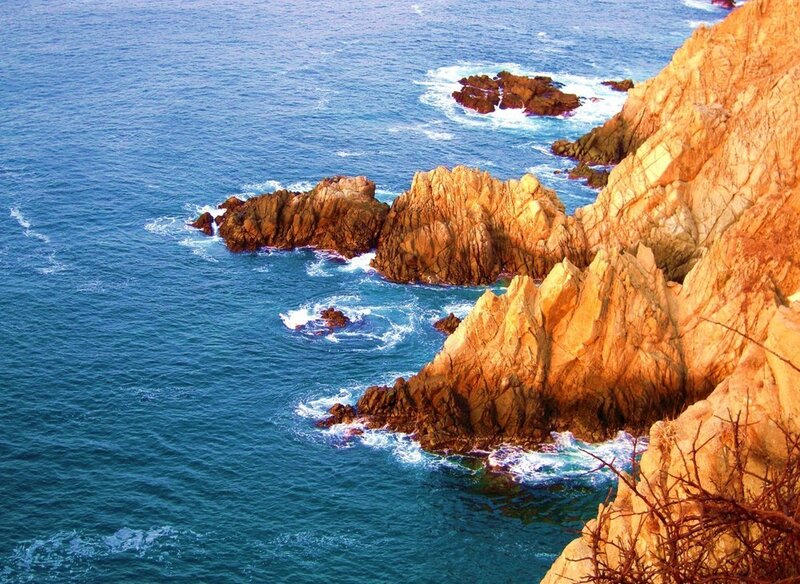 Rugged coastal cliffs at sunset