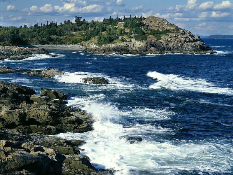 Rugged coastal island with crashing waves