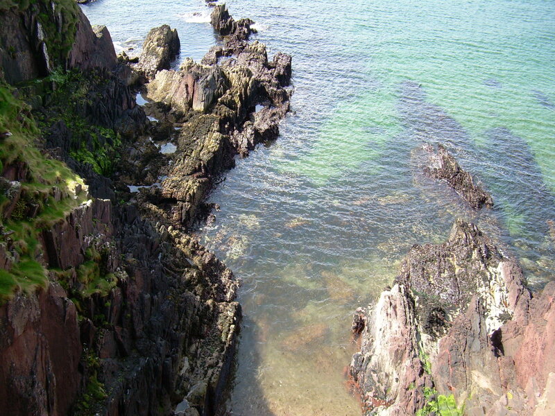Rugged coastal rocks and clear water