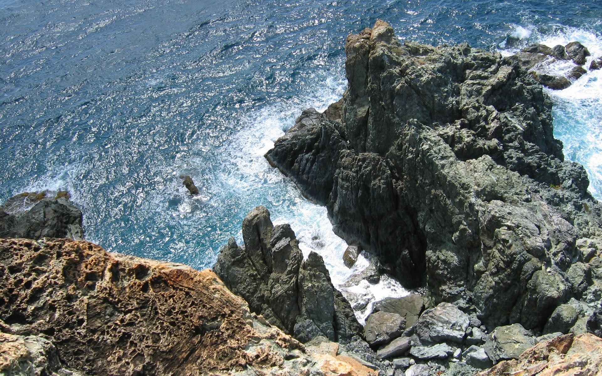 Rugged coastal rocks and ocean waves