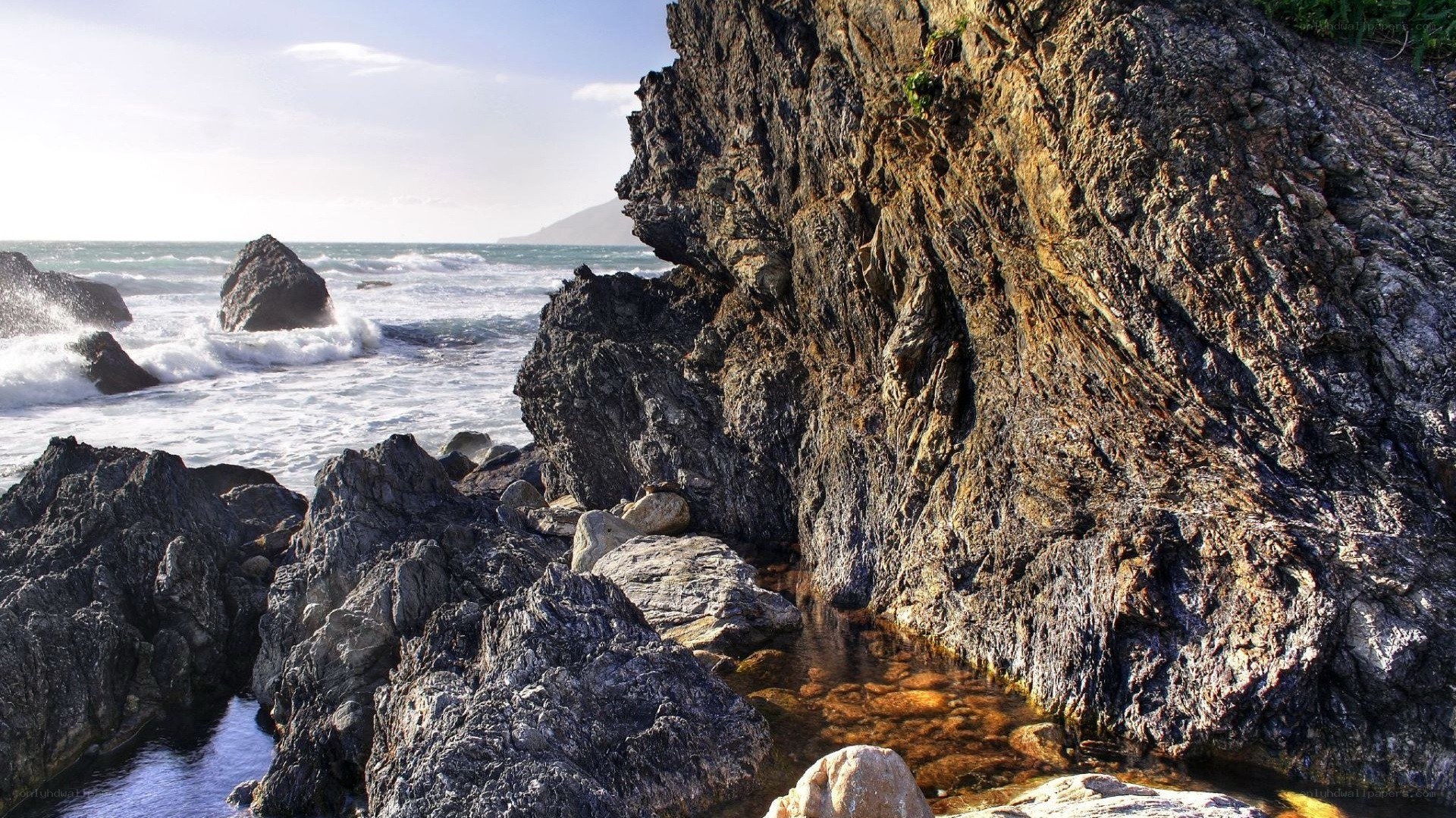 Rugged coastal rocks and ocean waves