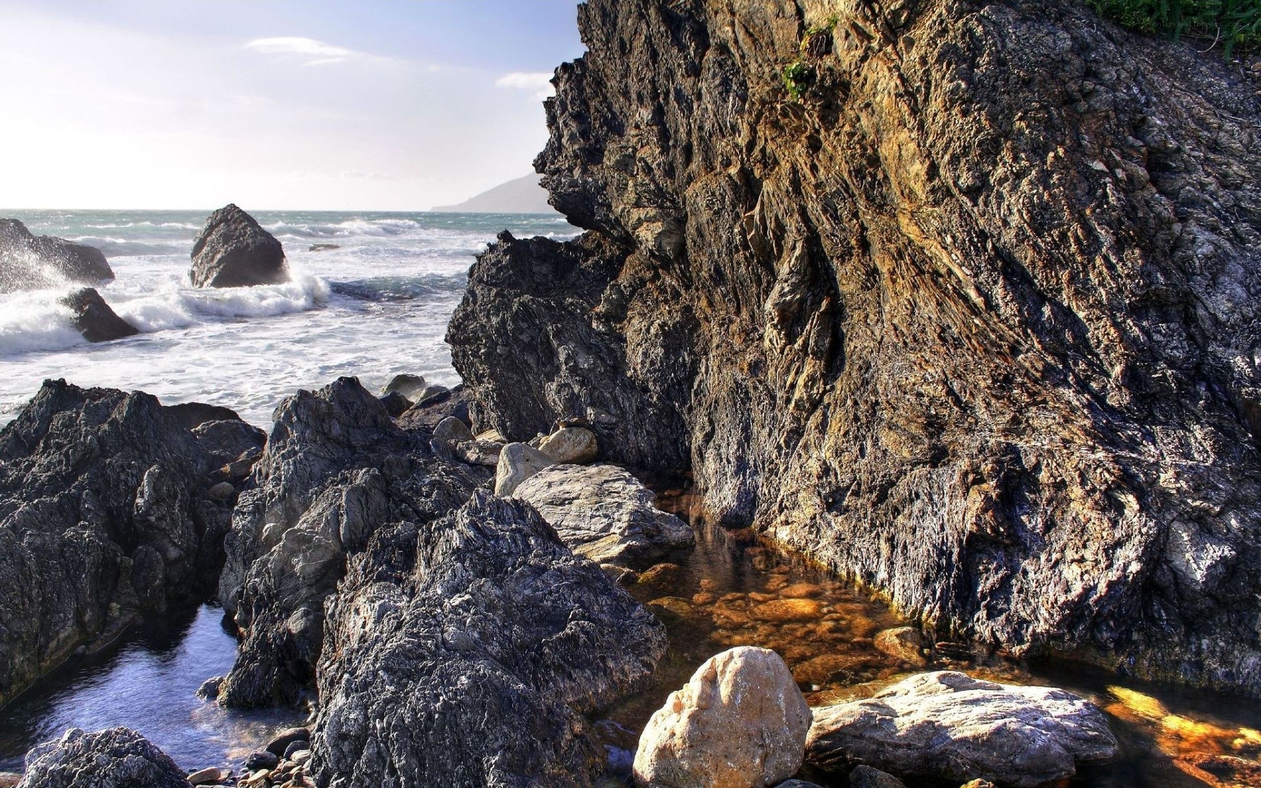 Rugged coastal rocks and waves