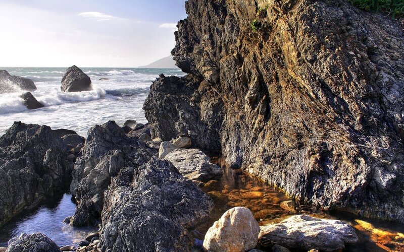 Rugged coastal rocks and waves