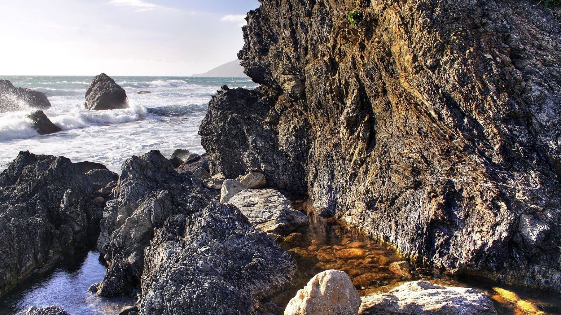 Rugged coastal rocks and waves