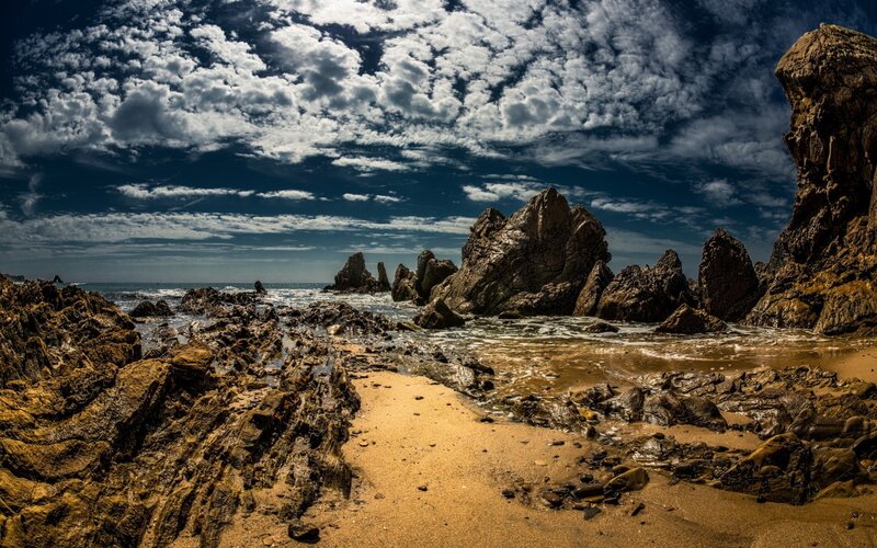 Rugged coastal rocks and waves