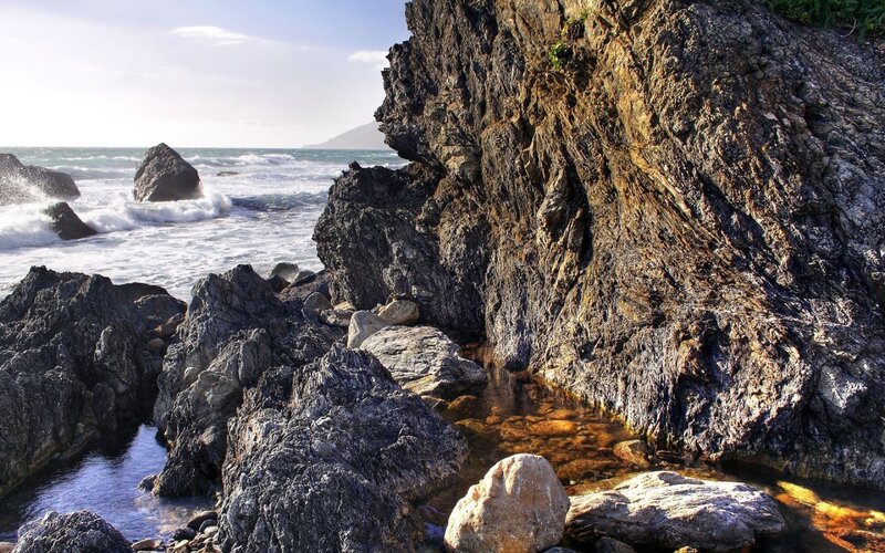 Rugged coastal rocks and waves