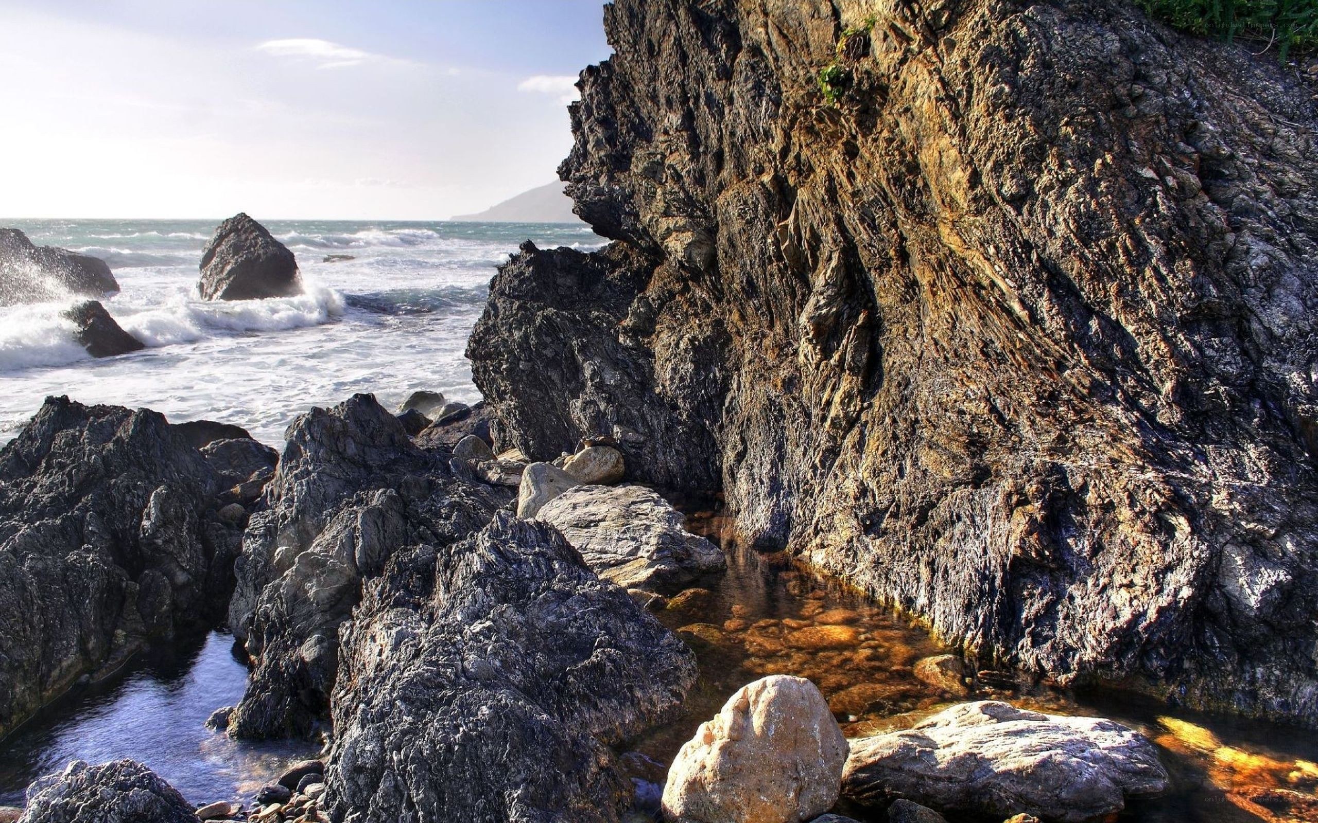 Rugged coastal rocks and waves