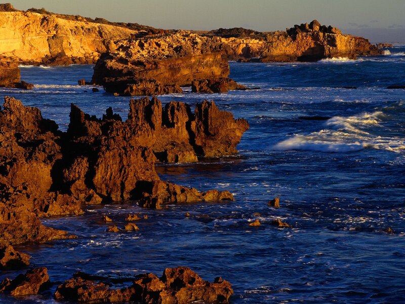 Rugged coastal rocks at sunset