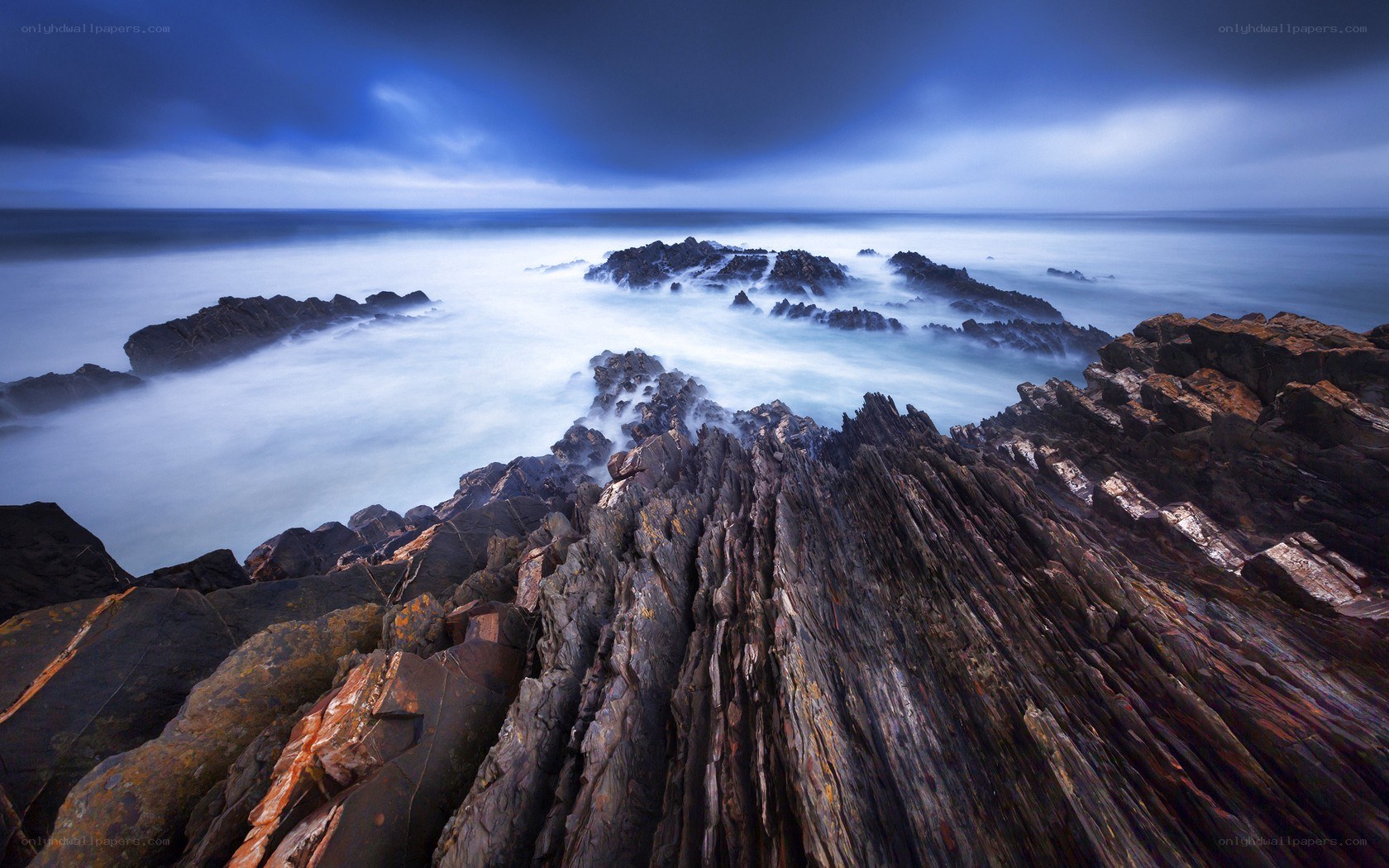Rugged coastal rocks at twilight