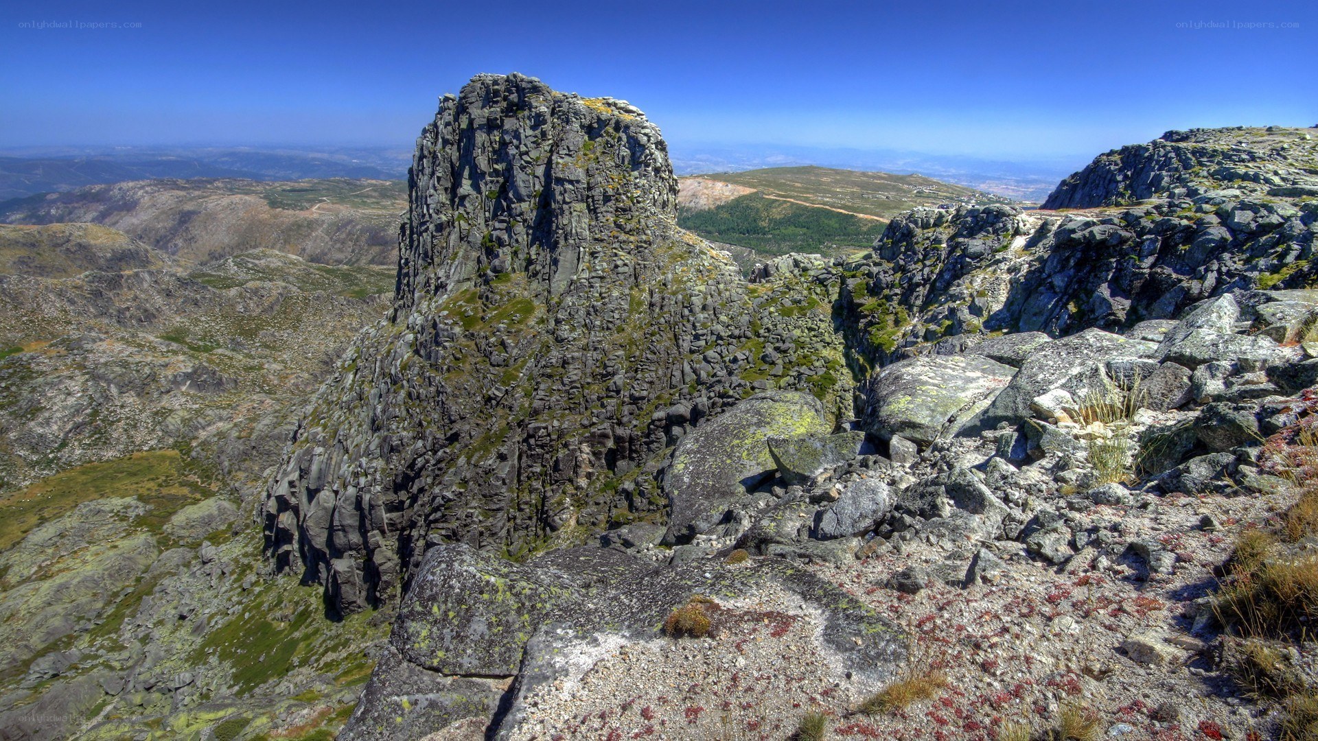 Rugged mountain peak under blue sky