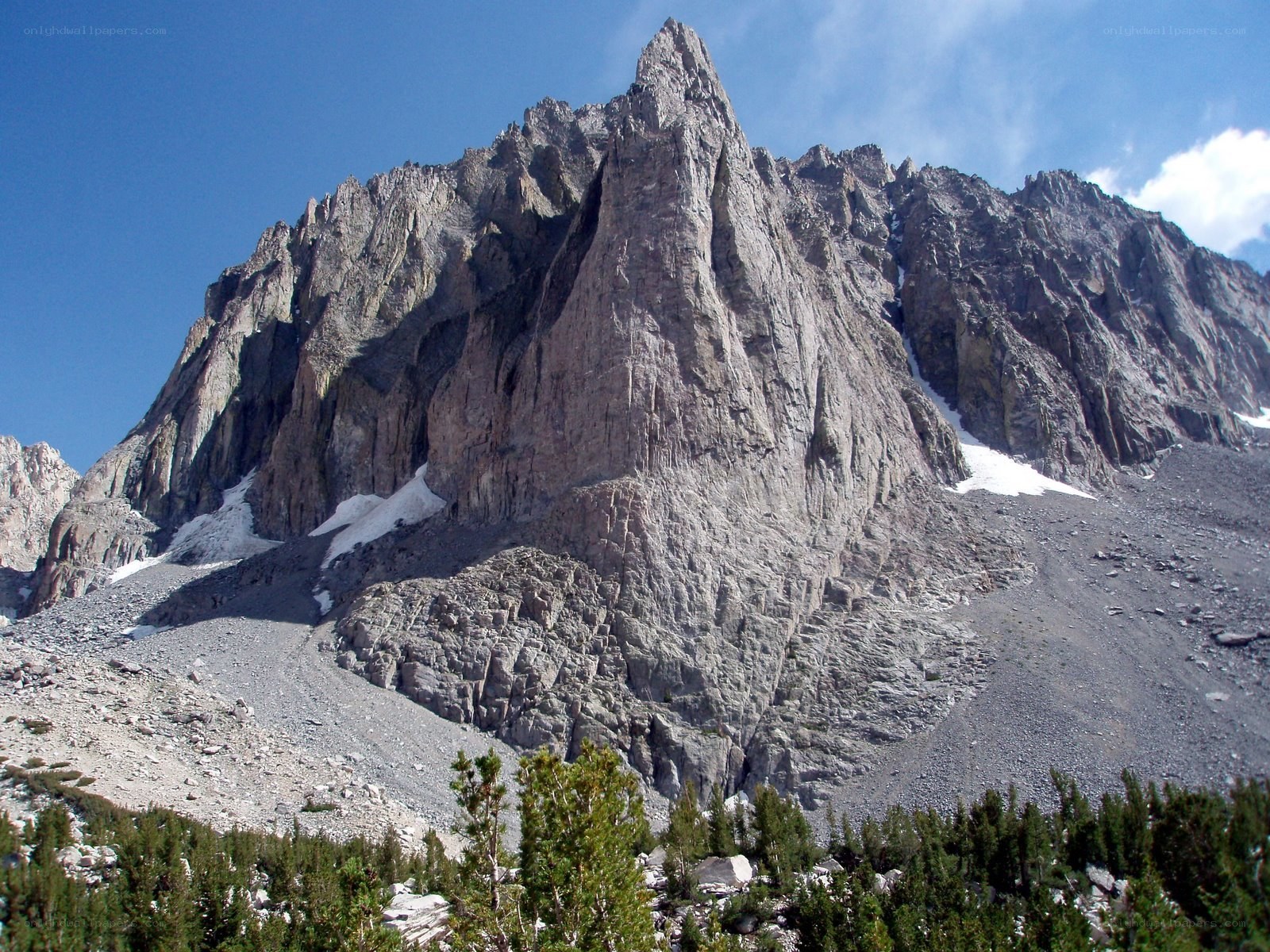 Rugged mountain peak under blue sky