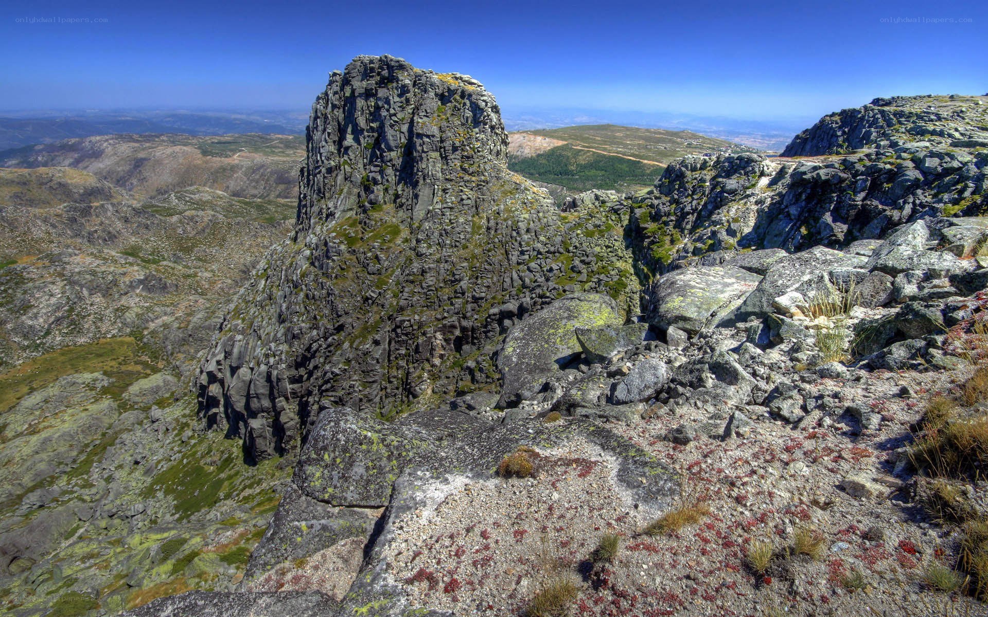Rugged mountain peak under blue sky