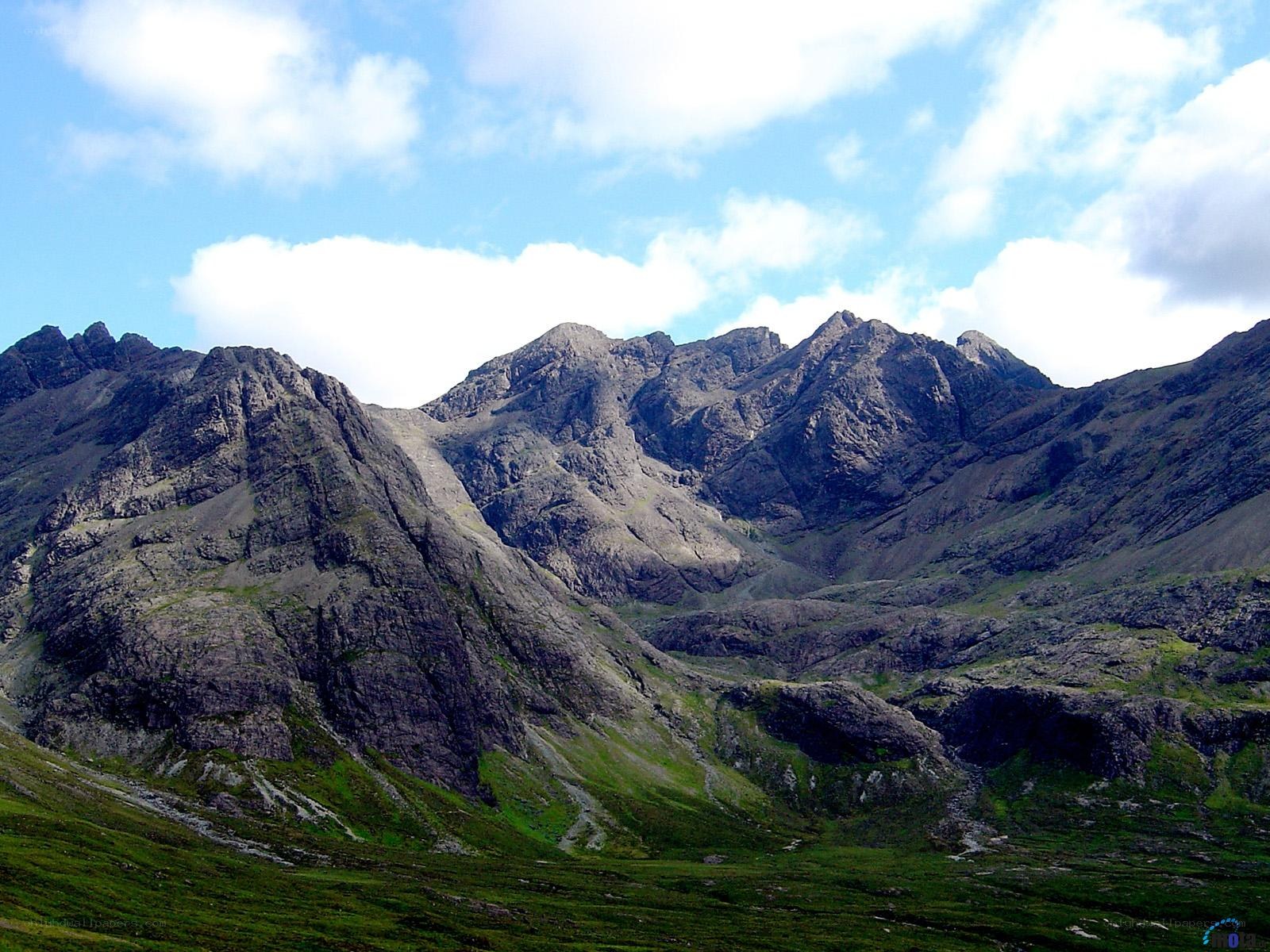 rugged mountain peaks under blue sky