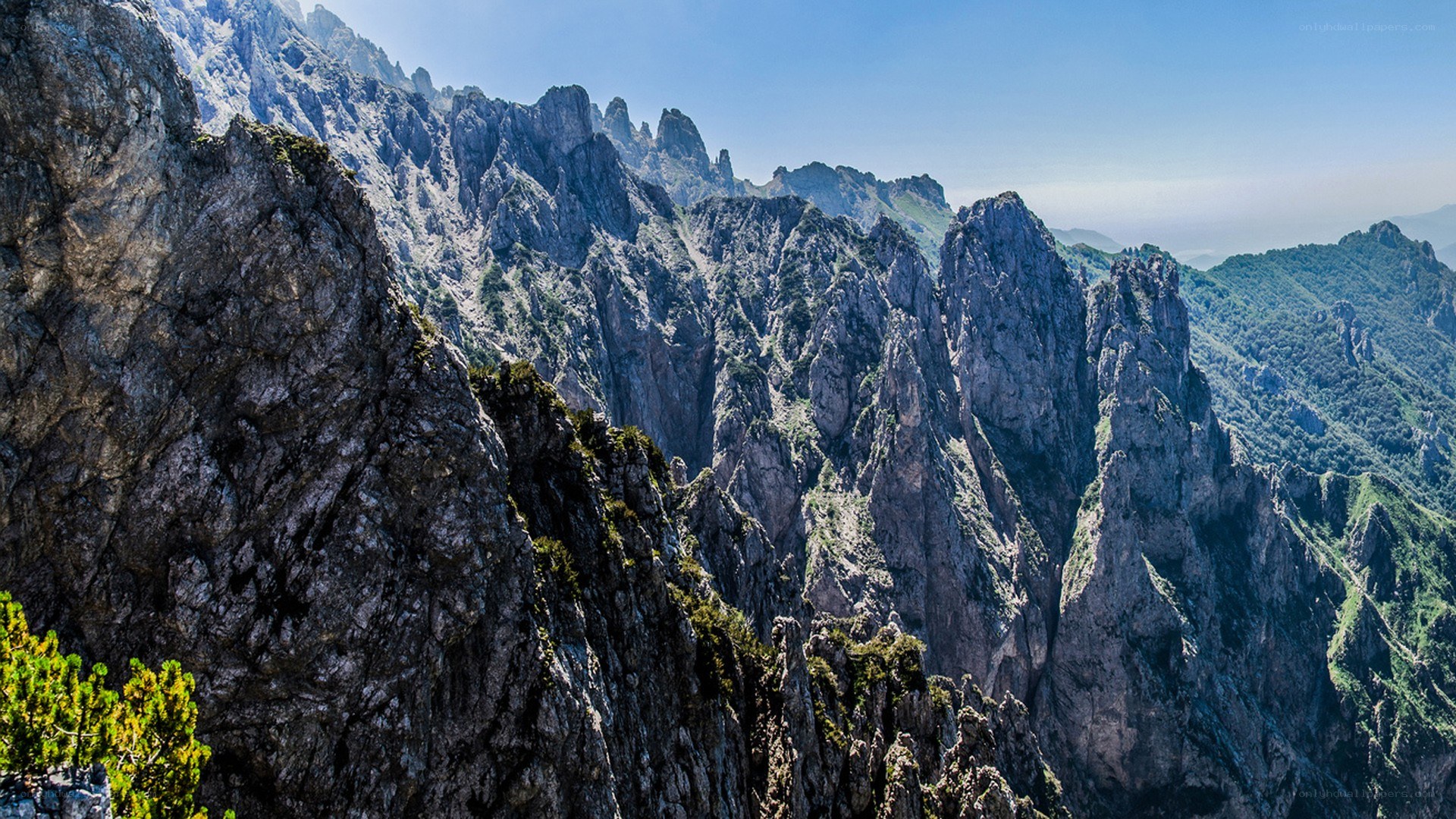 rugged mountain peaks under blue sky