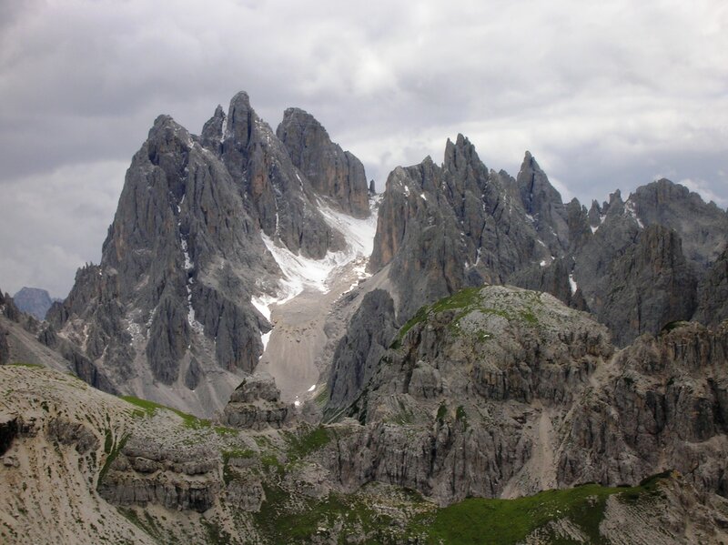 rugged mountain peaks under cloudy sky
