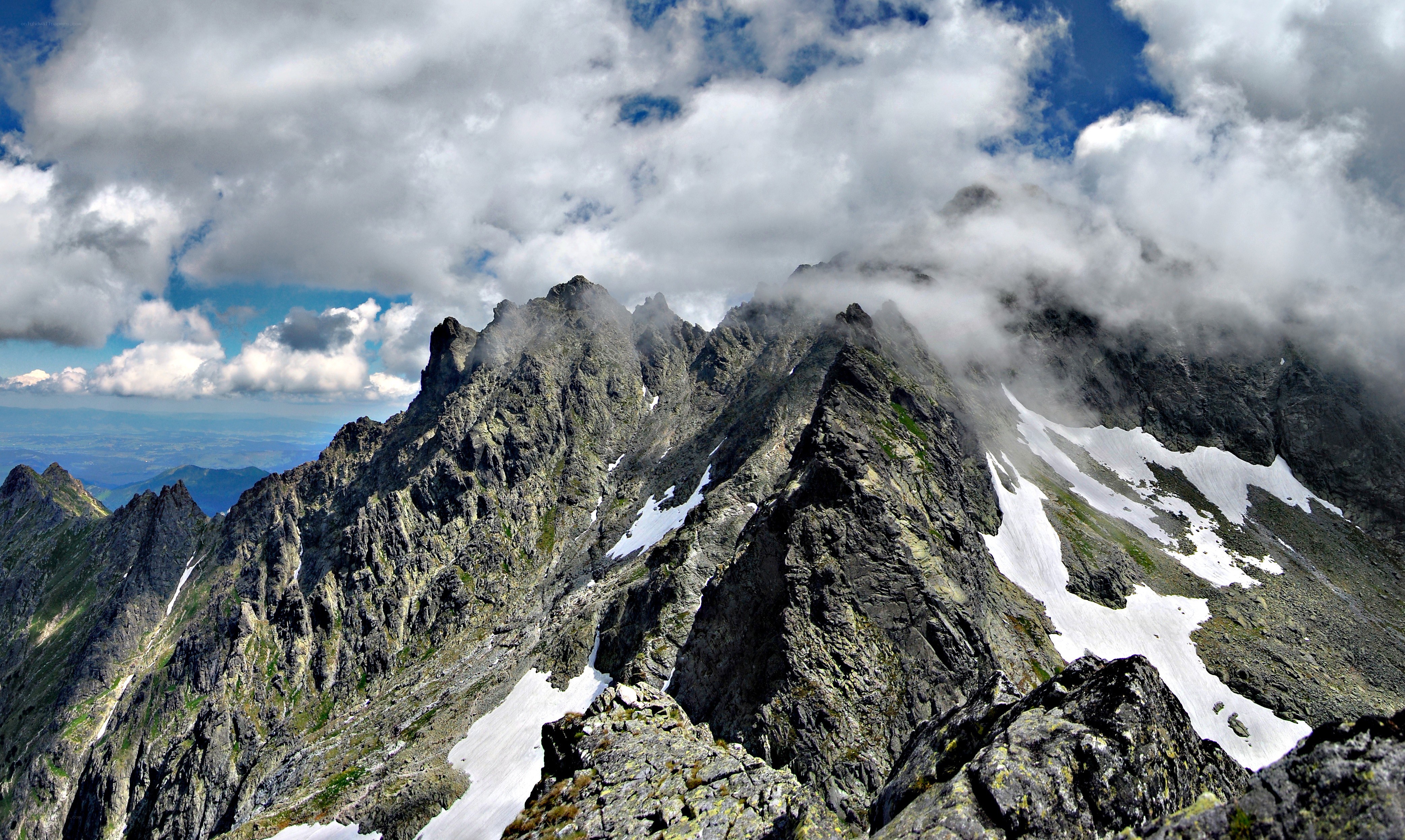 Rugged mountain peaks with snow