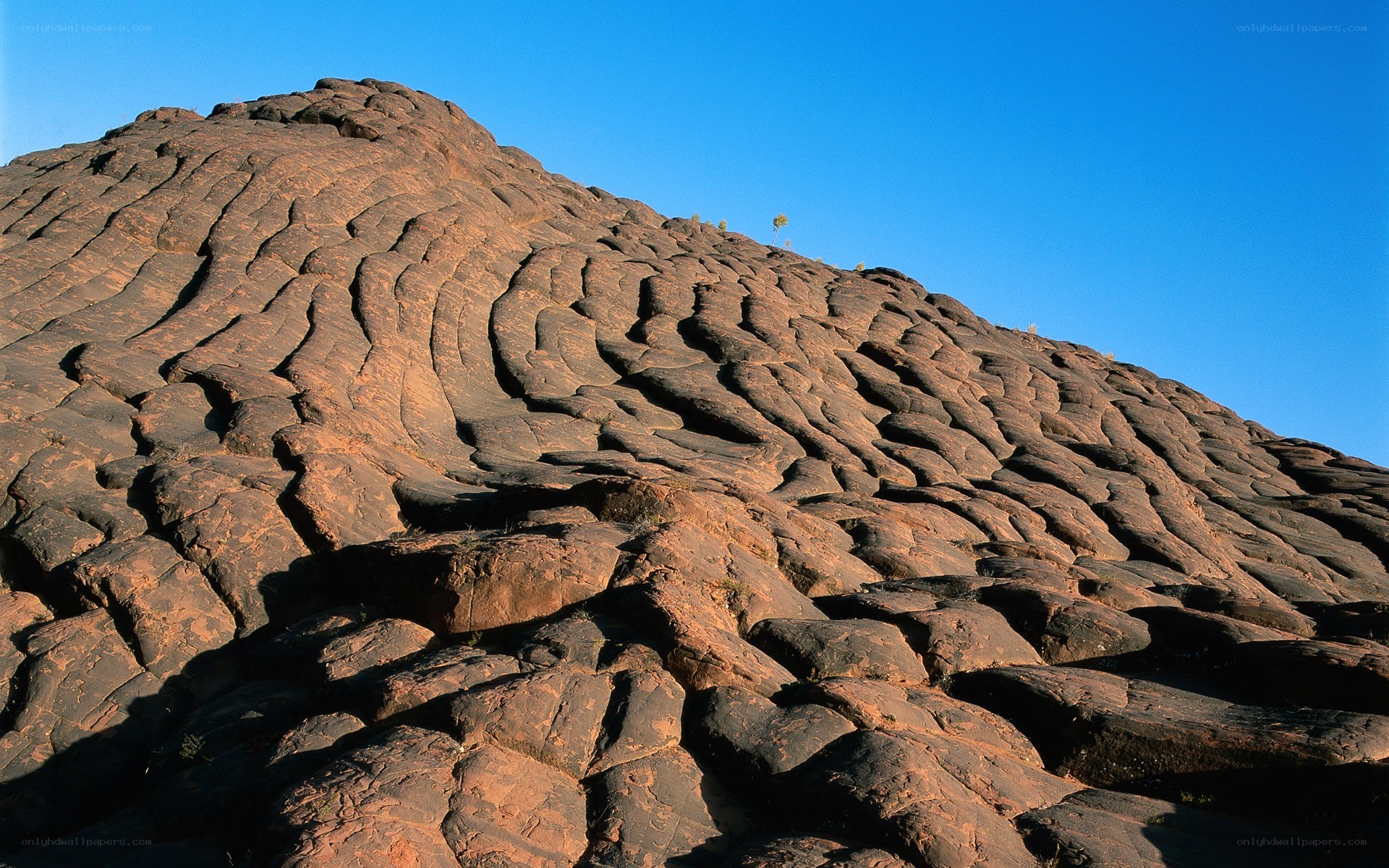 Rugged rock formation under blue sky