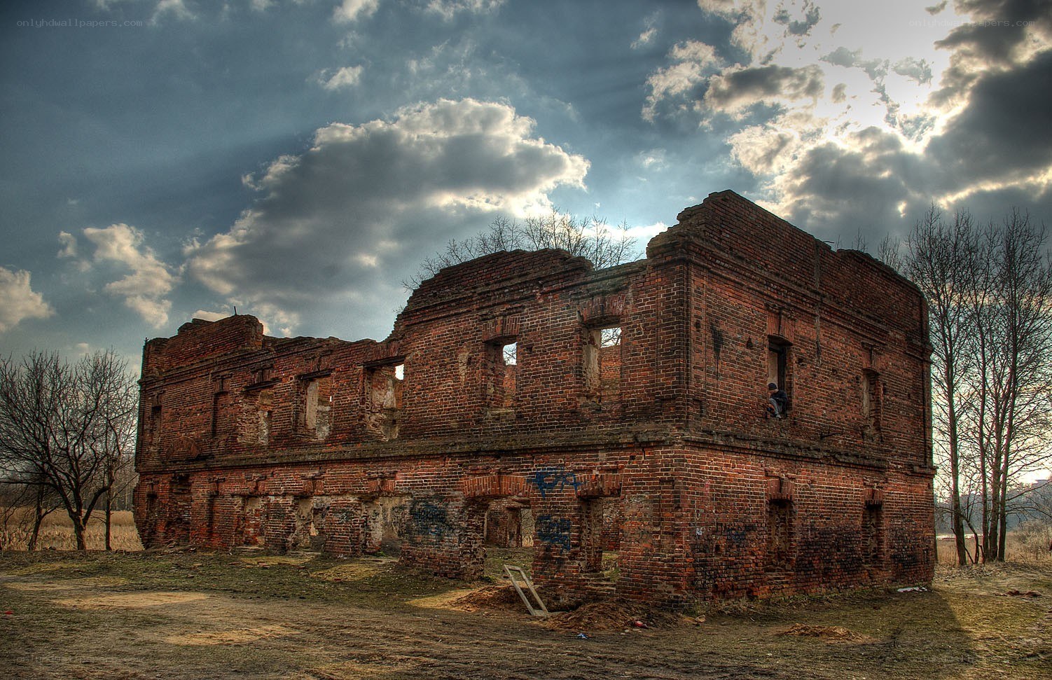 ruined brick building under cloudy sky