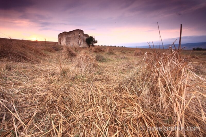 Ruined Building in Field