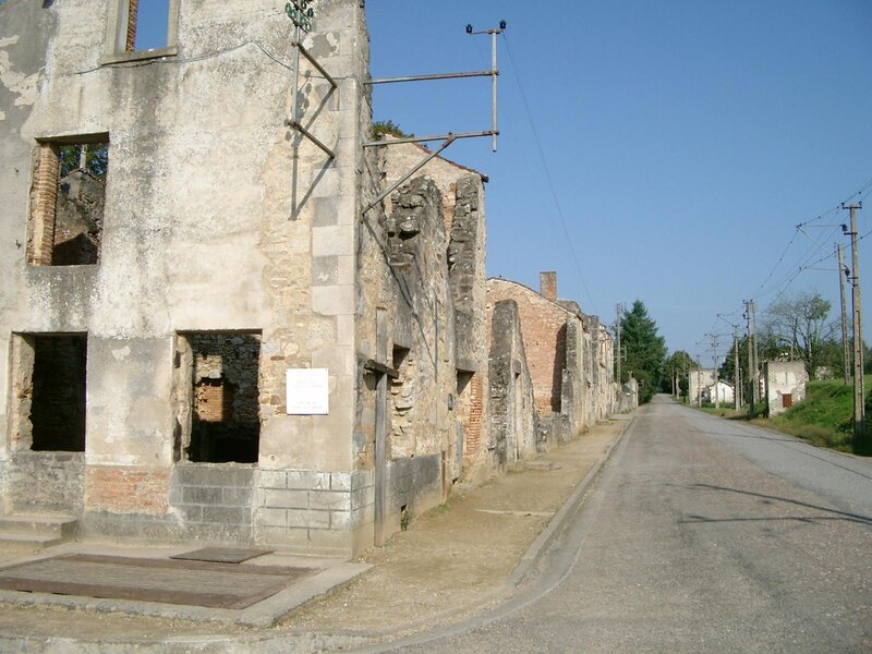 Ruined buildings along a road