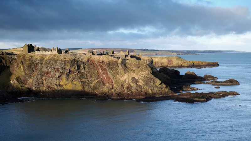 Ruined Castle on Cliff — Blue, Dramatic, Afternoon, Photograph, Ocean, Sky, Brown