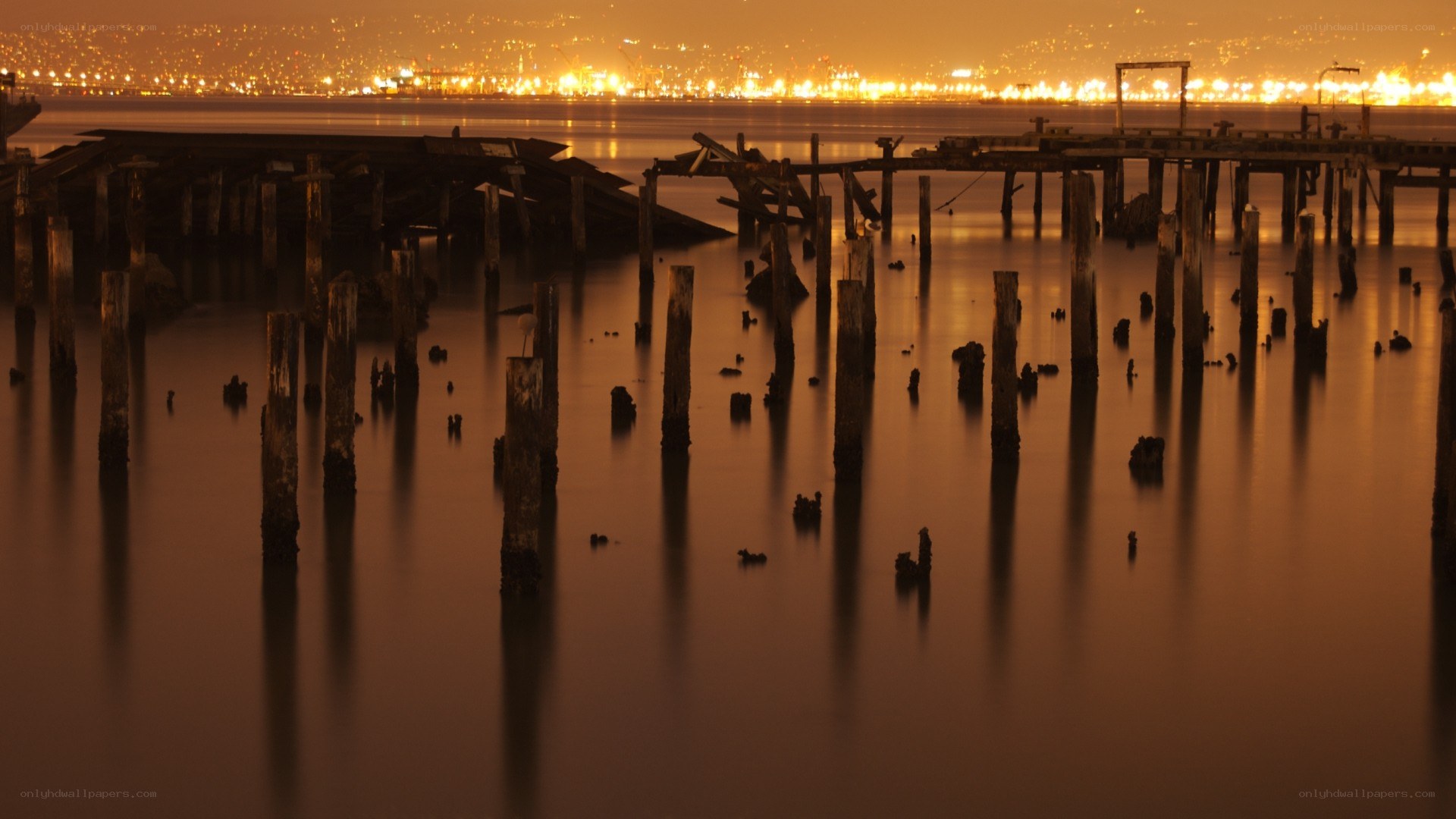 ruined pier at night