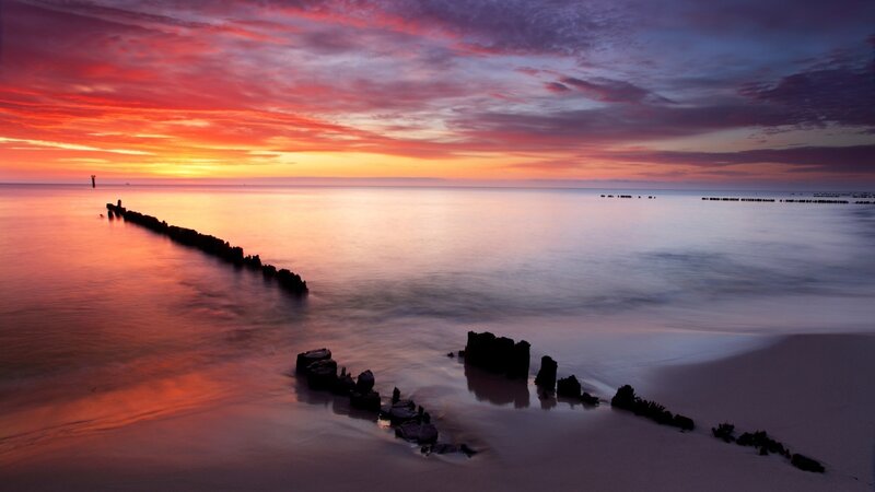 Ruined Pier at Sunset — Red, Dramatic, Photograph, Ocean, Sky, Sand, Orange