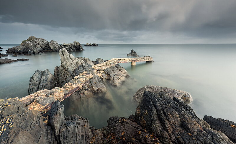 Ruined Pier on Rocky Shore