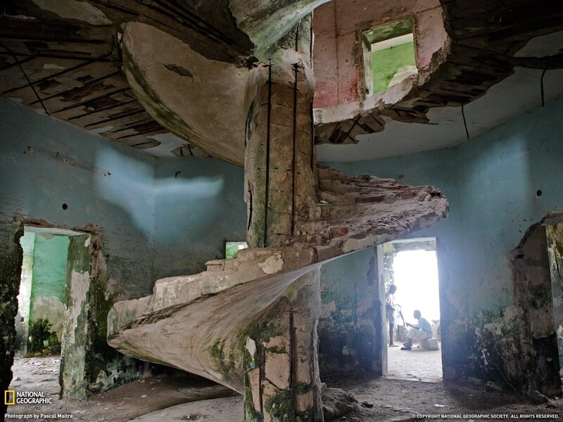 Ruined spiral staircase in abandoned building