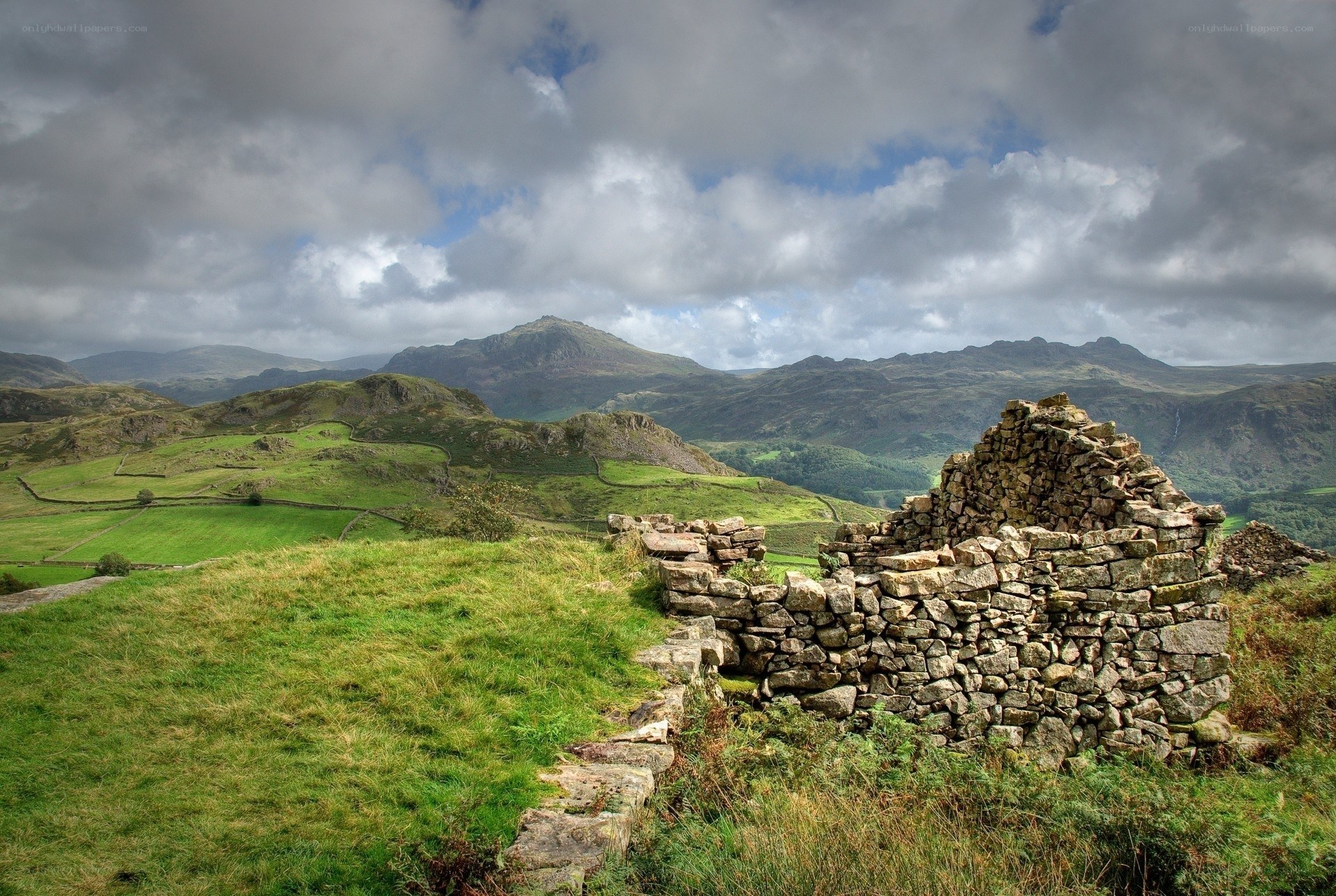 ruined stone wall in mountain landscape