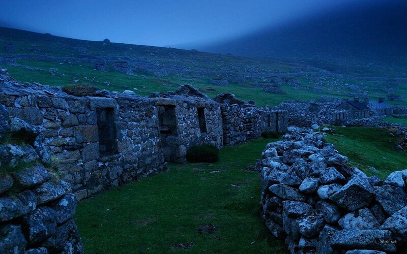 ruins at dusk on a hillside