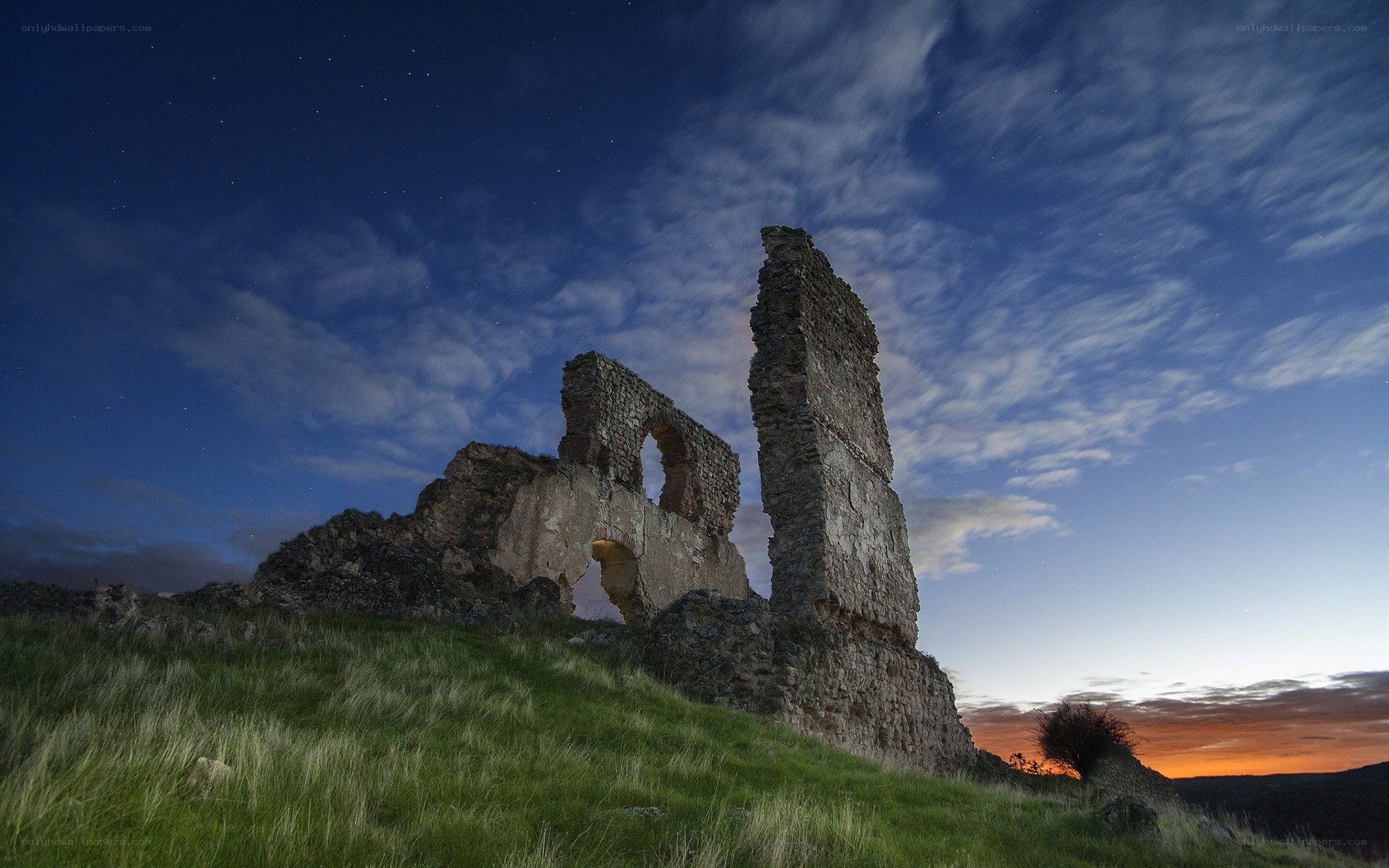 Ruins at dusk under a starry sky