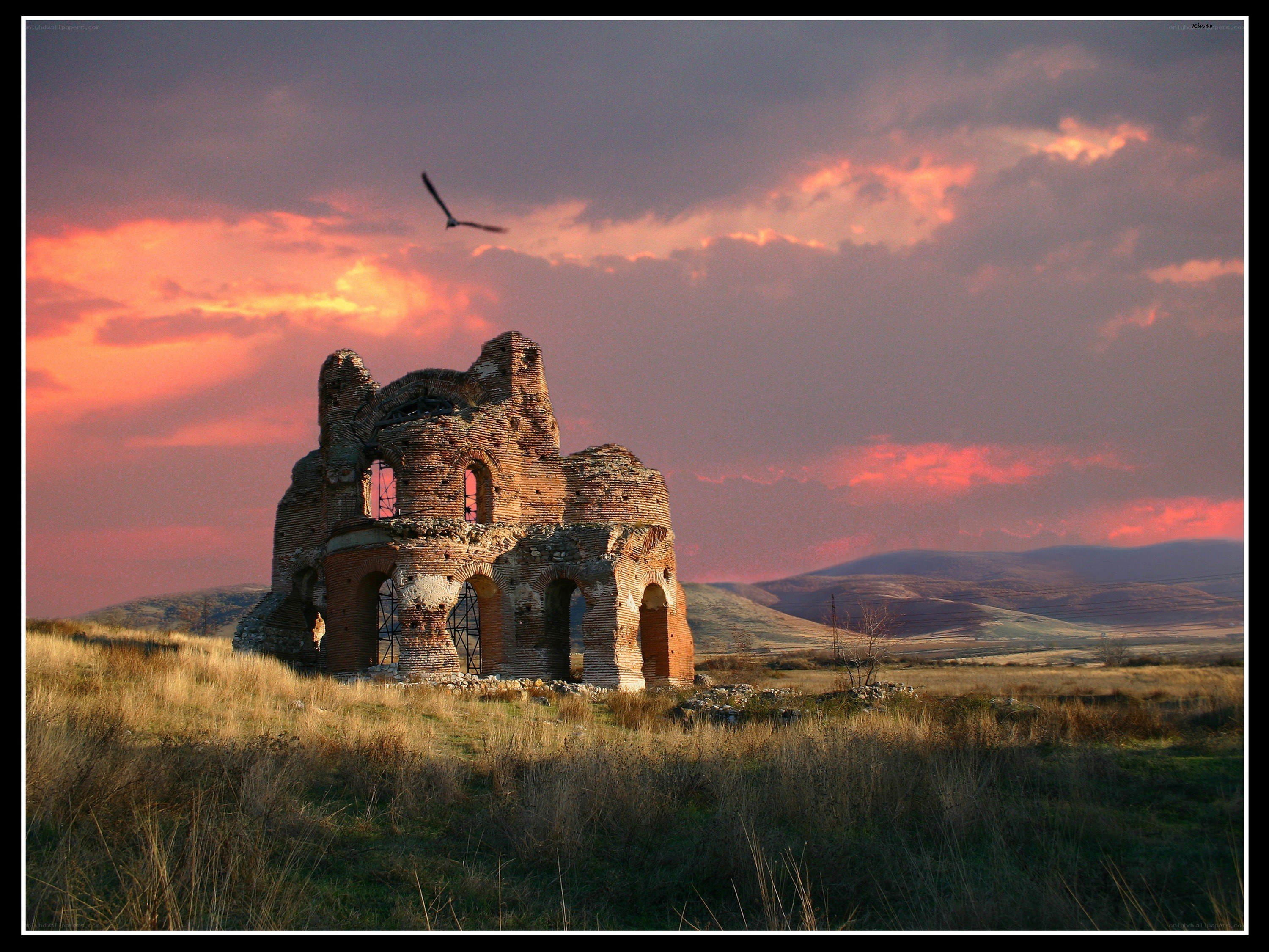 Ruins at sunset with bird