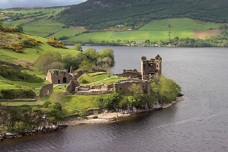ruins of a castle by a lake