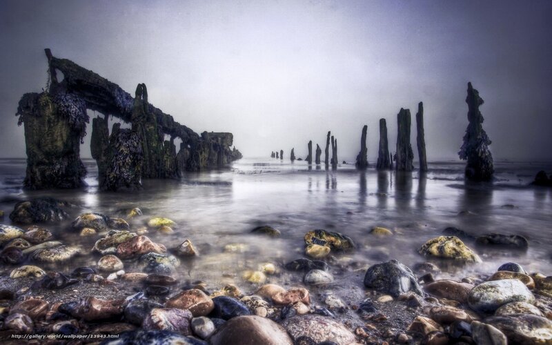 Ruins of a pier in fog