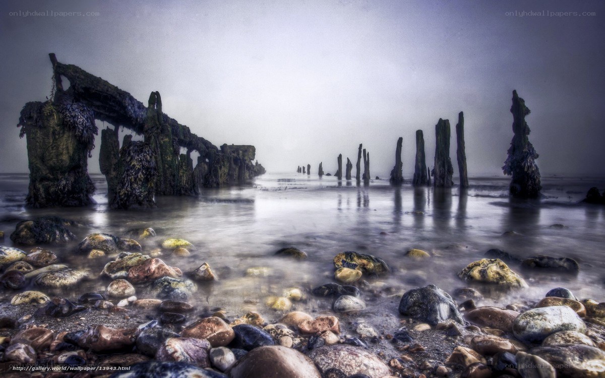 Ruins of a pier in fog