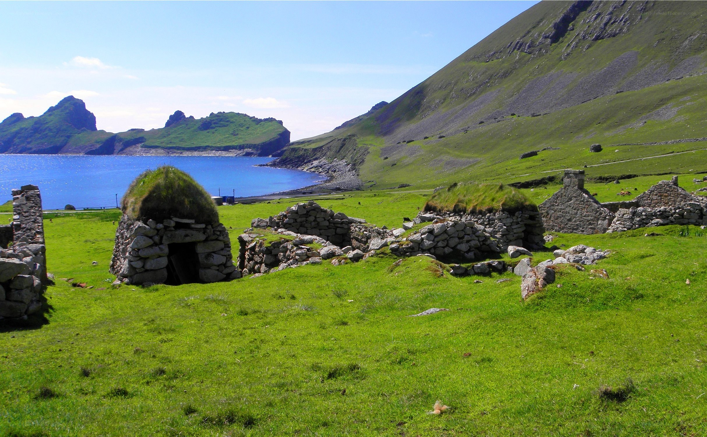 ruins on a green hillside
