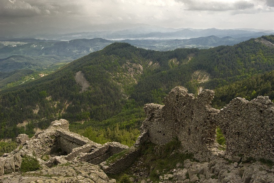 Ruins overlooking a forested valley