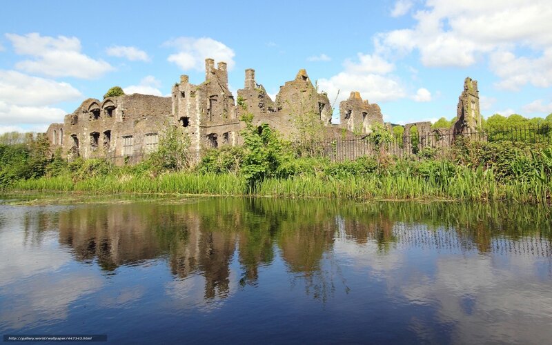 ruins reflected in a lake
