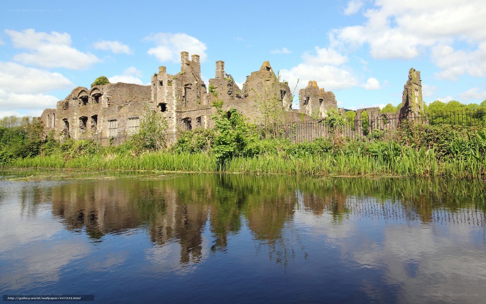 ruins reflected in a lake