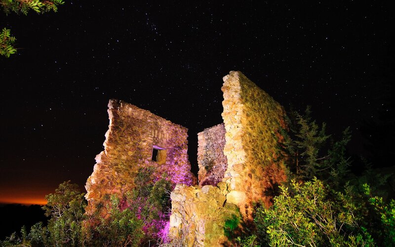 ruins under starry night sky
