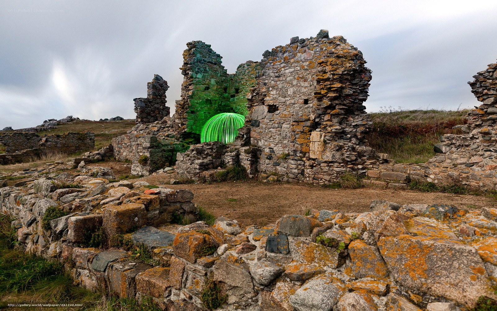 ruins with green light sculpture