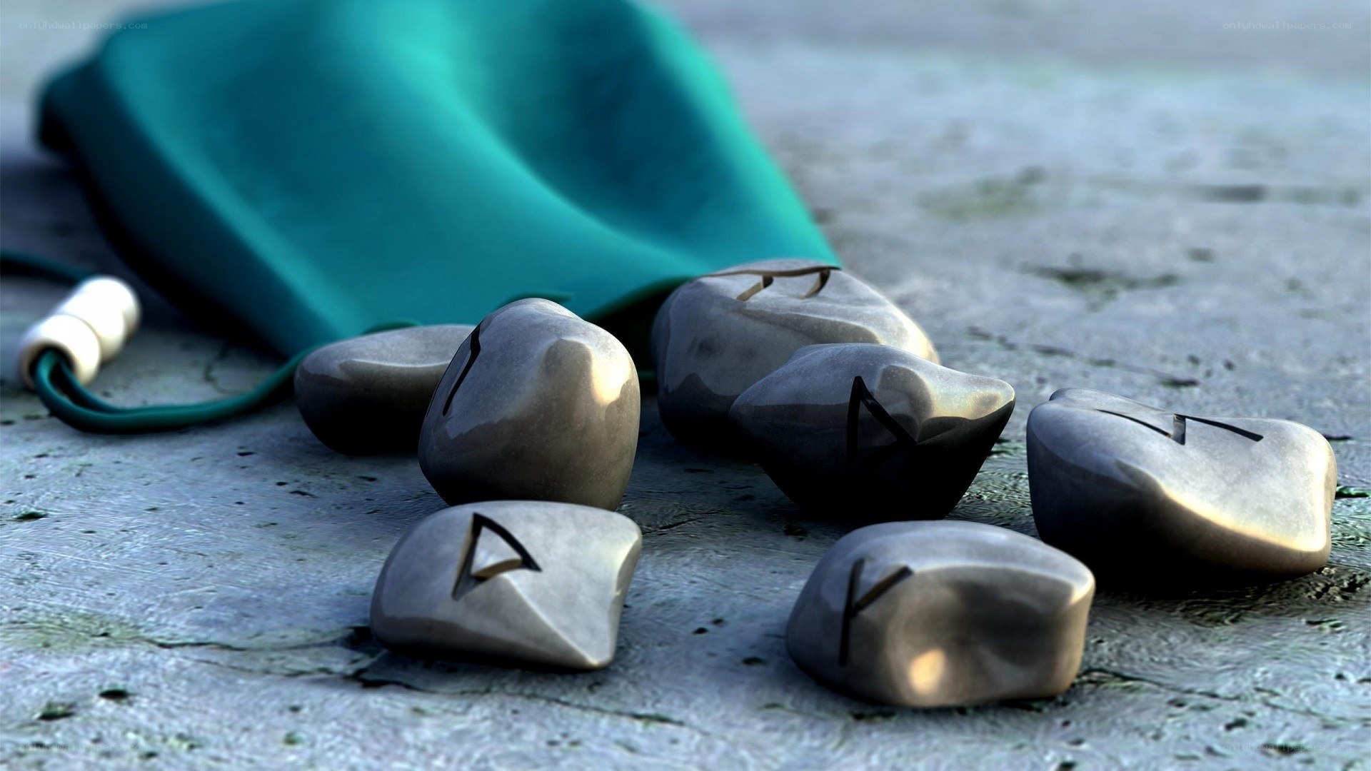 Rune stones on stone surface